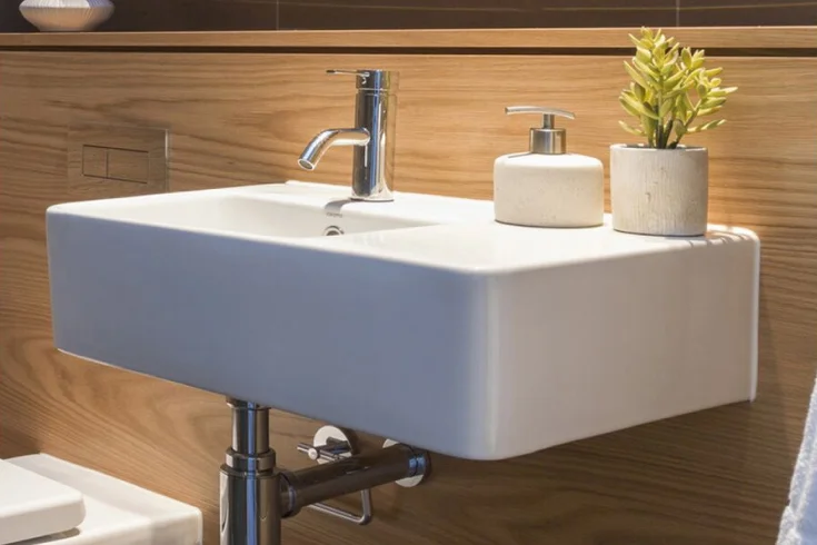 wall mounted sink in bathroom